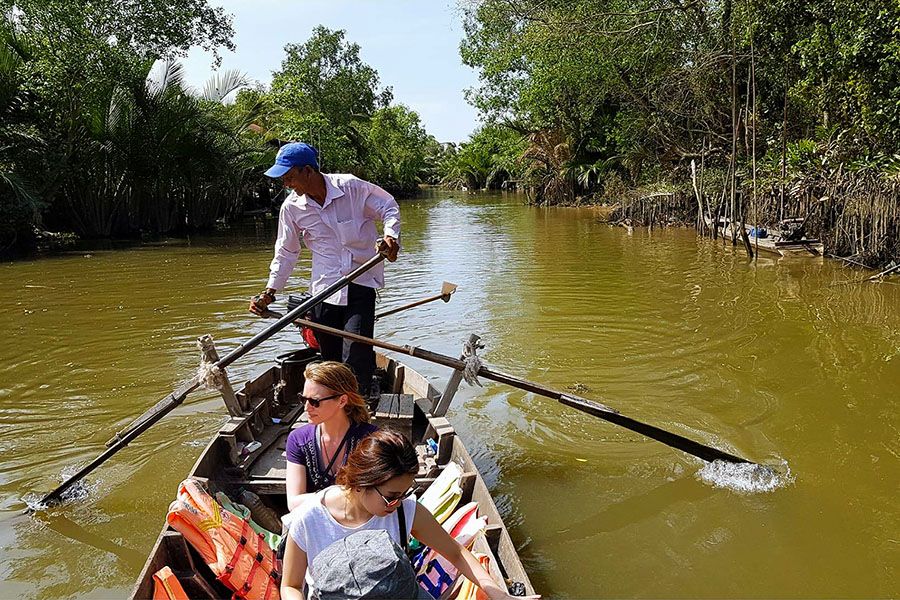 rowing boat in mekong detla