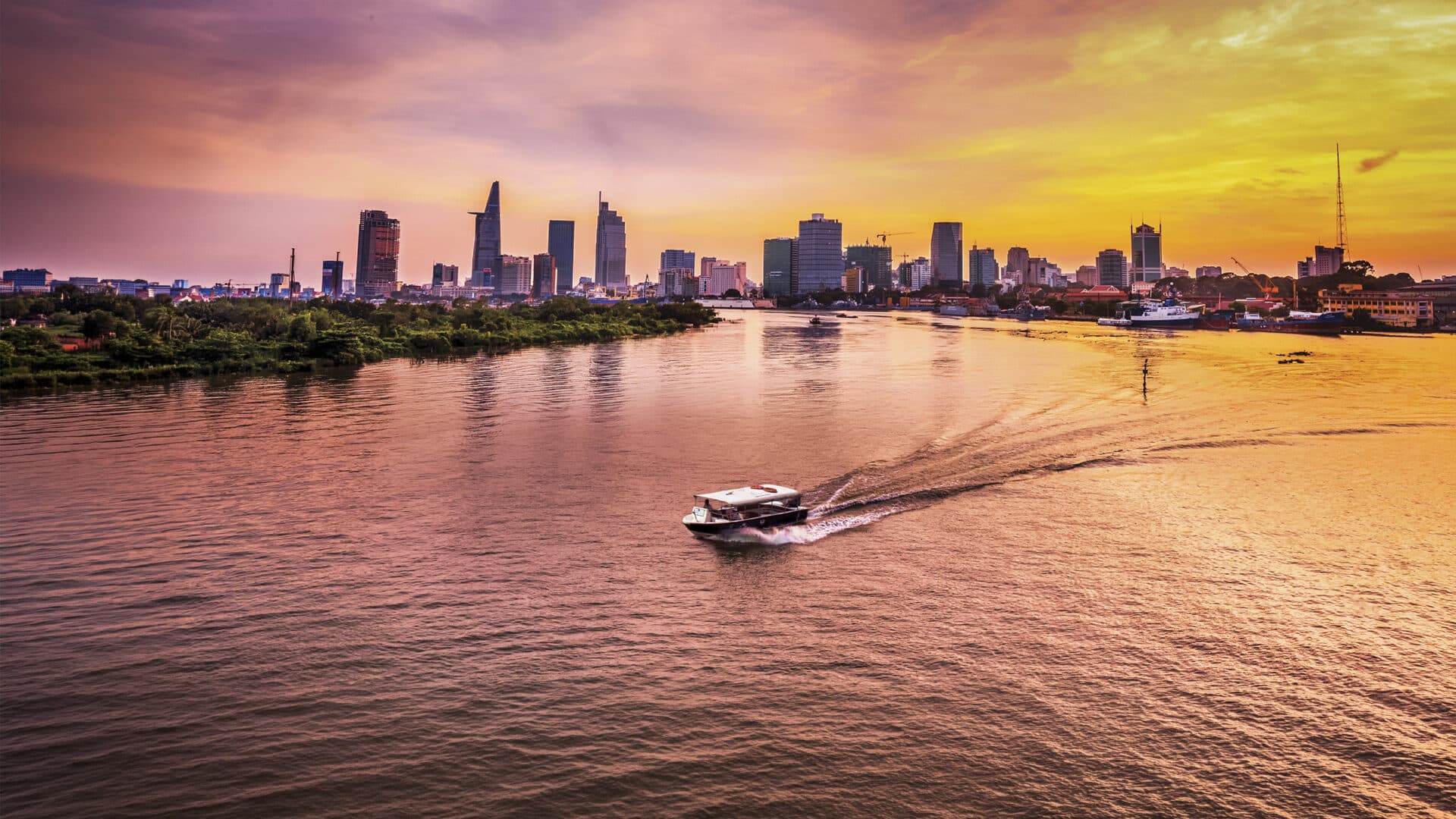 Les Rives speedboat on Saigon River at Sunset